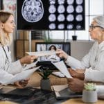 FDA Approves Easier Alzheimerโs Treatment Scientists discus Alzheimer's treatment (licensed content)